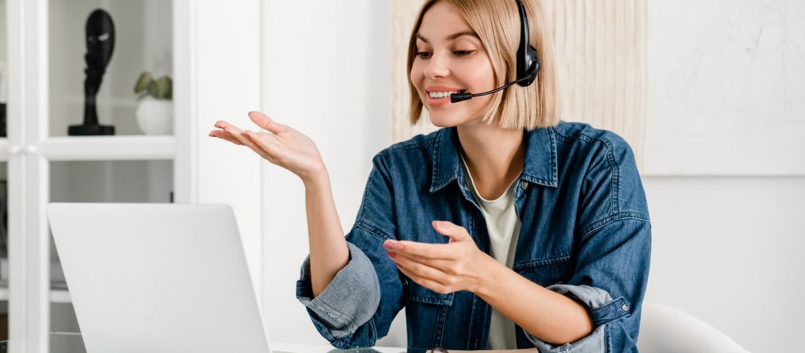 Certified translator woman using a computer and headset to deliver accurate and trusted document translation services in Canada.